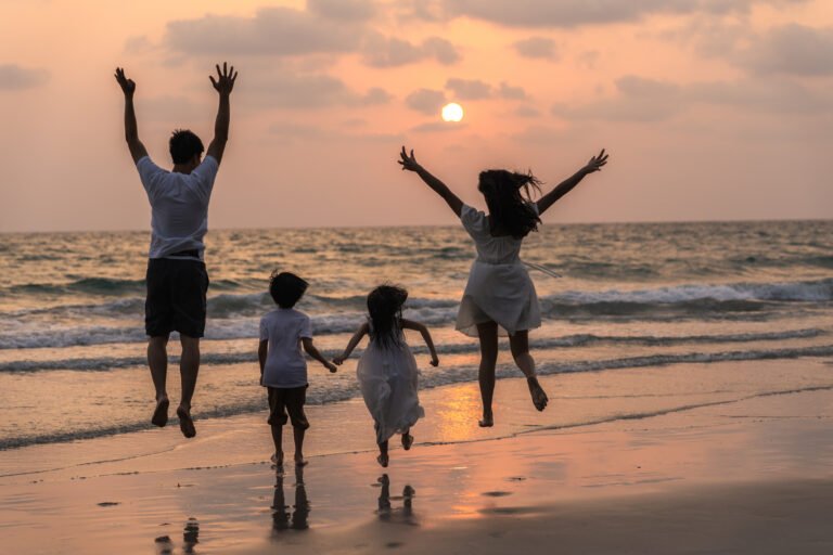 Asian young happy family enjoy vacation on beach in evening Dad salutetravelscom family holiday Asian young happy family enjoy vacation on beach in evening Dad